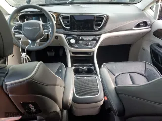 2023 Chrysler Pacifica Hybrid Limited with VIN 2C4RC1S77PR599221, listed as a Copart auction lot 82690554 with 12,013 mi miles and Salvage Title. Bid and sale history available at carsss.com. Image 8.