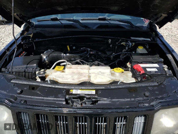 2012 Jeep Liberty Sport z VIN 1C4PJMAK2CW209468, wystawiony jako Copart lot #60091085 z przebiegiem 133 975 mil mil oraz Szkoda całkowita • Salvage title. Historia ofert i sprzedaży dostępna na DreamBid. Obrazek 11.
