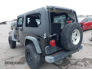2004 Jeep Wrangler Sport with VIN 1J4FA49S64P794559, listed as a IAAI auction lot 41644201 with 107,445 mi miles. Bid and sale history available at carsss.com. Image 3.
