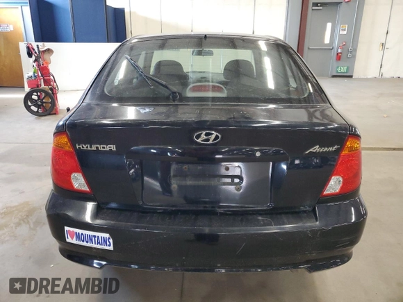2005 Hyundai Accent GLS with VIN KMHCG35C95U327960, listed as a Copart auction lot 77151314 with 101,556 mi miles and Clean Title. Bid and sale history available at carsss.com. Image 6.