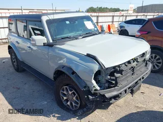 2023 Ford Bronco z VIN 1FMDE5BH5PLB37801, wystawiony jako IAAI lot #41691282 z przebiegiem 21 129 mil mil oraz . Historia ofert i sprzedaży dostępna na DreamBid. Obrazek 1.