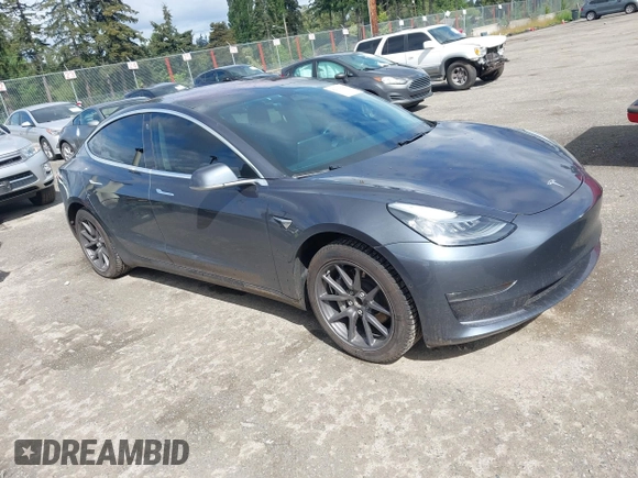 2018 Tesla Model 3 Long Range Battery z VIN 5YJ3E1EA2JF011588, wystawiony jako IAAI lot #42304226 z przebiegiem 56 819 mil mil oraz . Historia ofert i sprzedaży dostępna na DreamBid. Obrazek 1.