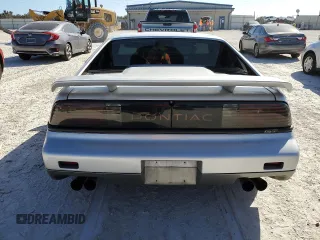 1986 Pontiac Fiero z VIN 1G2PG9799GP261135, wystawiony jako Copart lot #77305934 z przebiegiem 53 837 mil mil oraz Szkody całkowita. Historia ofert i sprzedaży dostępna na DreamBid. Obrazek 6.