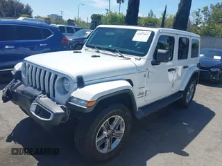 2019 Jeep Wrangler Unlimited Sahara with VIN 1C4HJXENXKW684942, listed as a IAAI auction lot 42021869 with 55,137 mi miles and . Bid and sale history available at DreamBid. Image 2.