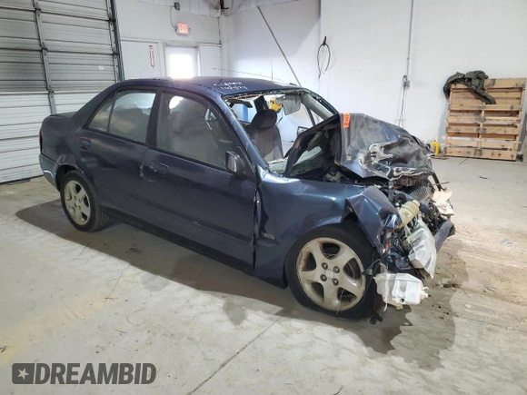 2000 Mazda Protege ES with VIN JM1BJ221XY0211385, listed as a Copart auction lot 48225605 with Not Provided miles and Non Repairable. Bid and sale history available at DreamBid. Image 4.