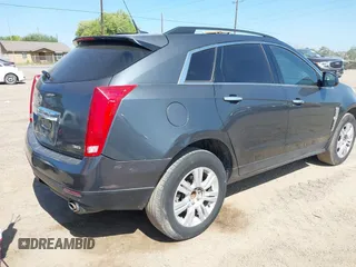 2012 Cadillac SRX with VIN 3GYFNGE32CS546815, listed as a IAAI auction lot 42014765 with 142,373 mi miles. Bid and sale history available at carsss.com. Image 4.