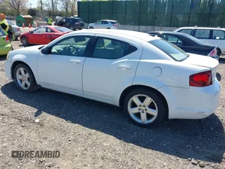 2013 Dodge Avenger SE with VIN 1C3CDZABXDN551796, listed as a IAAI auction lot 42142302 with 999,999 mi miles. Bid and sale history available at carsss.com. Image 3.