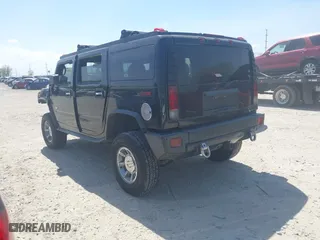 2005 Hummer H2 SUV with VIN 5GRGN23U25H128791, listed as a IAAI auction lot 42115436 with 286,818 mi miles. Bid and sale history available at carsss.com. Image 3.