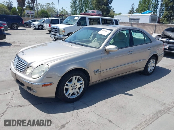 2003 Mercedes-Benz E-Class 3.2L with VIN WDBUF65JX3A236768, listed as a IAAI auction lot 42094824 with 251,896 mi miles. Bid and sale history available at carsss.com. Image 2.