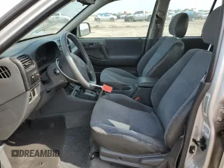 2001 Honda Passport LX z VIN 4S6CK58W414405269, wystawiony jako Copart lot #55362765 z przebiegiem 158 166 mil mil oraz Szkody całkowita. Historia ofert i sprzedaży dostępna na DreamBid. Obrazek 7.