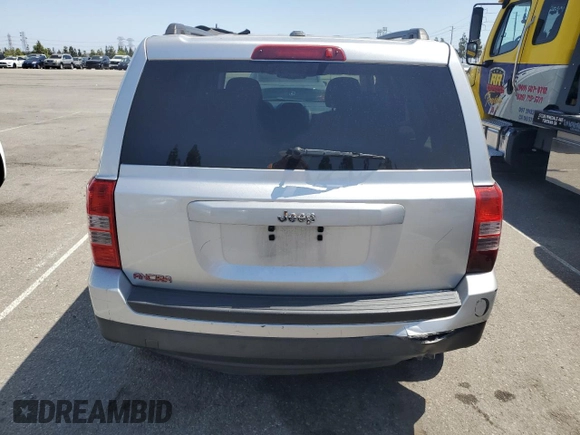 2014 Jeep Patriot Sport with VIN 1C4NJPBB1ED512442, listed as a Copart auction lot 61415565 with 211,715 mi miles and Salvage title. Bid and sale history available at DreamBid. Image 6.
