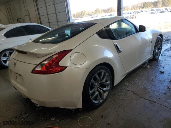 2013 Nissan 370Z with VIN JN1AZ4EH0DM880201, listed as a Copart auction lot 87869285 with 79142 miles and Salvage Title. Bid and sale history available at carsss.com. Image 3.