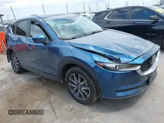 2018 Mazda CX-5 Touring z VIN JM3KFACM5J1442416, wystawiony jako IAAI lot #42093137 z przebiegiem 65 102 mil mil oraz . Historia ofert i sprzedaży dostępna na DreamBid. Obrazek 1.