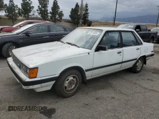 1984 Toyota Camry z VIN JT2SV16E3E0220882, wystawiony jako Copart lot #53514345 z przebiegiem 112 430 mil mil oraz Czysty tytuł • Clean title. Historia ofert i sprzedaży dostępna na DreamBid. Obrazek 1.