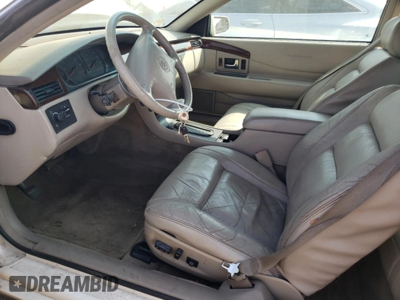 2000 Cadillac Eldorado z VIN 1G6EL12Y2YU179560, wystawiony jako Copart lot #70635784 z przebiegiem 92 959 mil mil oraz Czysty tytuł • Clean title. Historia ofert i sprzedaży dostępna na DreamBid. Obrazek 7.