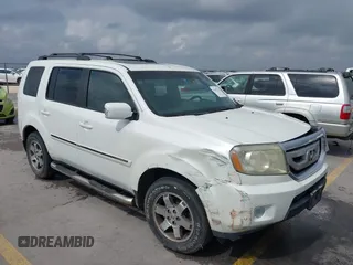 2011 Honda Pilot Touring z VIN 5FNYF3H91BB025693, wystawiony jako IAAI lot #41695703 z przebiegiem 223 206 mil mil oraz . Historia ofert i sprzedaży dostępna na DreamBid. Obrazek 1.