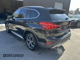 2017 BMW X1 xDrive28i with VIN WBXHT3C32H5F67896, listed as a IAAI auction lot 41823288 with 80,130 mi miles. Bid and sale history available at carsss.com. Image 3.