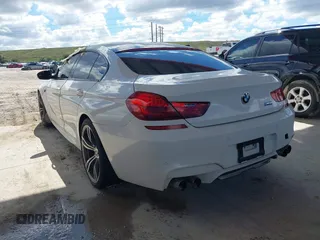 2014 BMW M6 z VIN WBS6C9C50EDV73809, wystawiony jako IAAI lot #41648991 z przebiegiem 68 054 mil mil oraz . Historia ofert i sprzedaży dostępna na DreamBid. Obrazek 3.