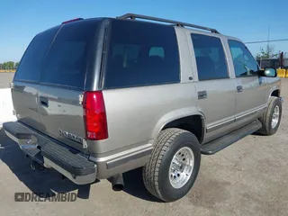 1999 Chevrolet Tahoe Z71 with VIN 1GNEK13R7XJ521373, listed as a IAAI auction lot 42131893 with 250,712 mi miles and . Bid and sale history available at DreamBid. Image 4.