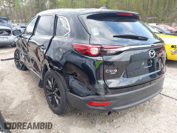 2022 Mazda CX-9 Touring Plus z VIN JM3TCBAYXN0613830, wystawiony jako IAAI lot #41942849 z przebiegiem 50 193 mil mil oraz . Historia ofert i sprzedaży dostępna na DreamBid. Obrazek 3.