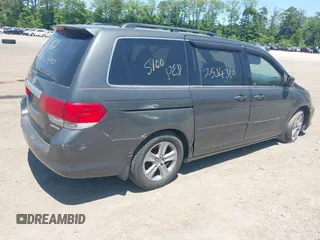 2010 Honda Odyssey Touring z VIN 5FNRL3H90AB085105, wystawiony jako IAAI lot #42142123 z przebiegiem Nie podano mil oraz . Historia ofert i sprzedaży dostępna na DreamBid. Obrazek 4.
