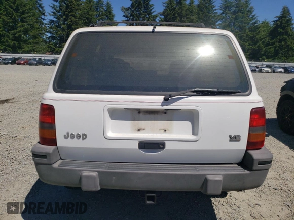 1994 Jeep Grand Cherokee Laredo with VIN 1J4GZ58Y7RC113333, listed as a Copart auction lot 57995734 with 220,950 mi miles and Clean Title. Bid and sale history available at carsss.com. Image 6.