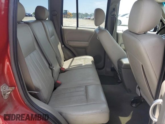 2005 Jeep Liberty Limited z VIN 1J4GL58KX5W660196, wystawiony jako Copart lot #60541585 z przebiegiem 128 939 mil mil oraz Szkoda całkowita • Salvage title. Historia ofert i sprzedaży dostępna na DreamBid. Obrazek 11.