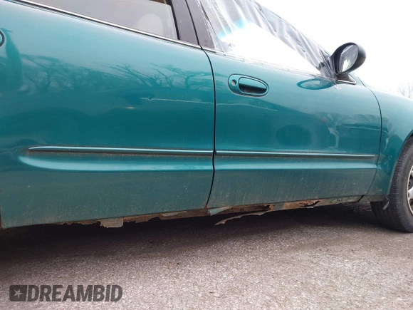 1999 Oldsmobile Alero GL z VIN 1G3NL52T7XC398799, wystawiony jako IAAI lot #41911602 z przebiegiem 252 504 mil mil oraz . Historia ofert i sprzedaży dostępna na DreamBid. Obrazek 12.