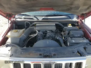 2010 Jeep Commander Sport z VIN 1J4RG4GK0AC156826, wystawiony jako Copart lot #50707345 z przebiegiem 213 694 mil mil oraz Szkoda całkowita • Salvage title. Historia ofert i sprzedaży dostępna na DreamBid. Obrazek 13.