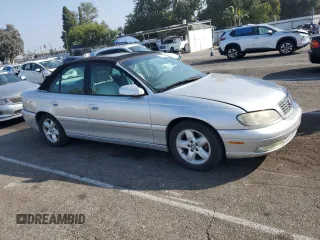2000 Cadillac Catera z VIN W06VR54R1YR003905, wystawiony jako Copart lot #76417144 z przebiegiem 80 894 mil mil oraz Tytuł czysty. Historia ofert i sprzedaży dostępna na DreamBid. Obrazek 4.