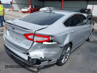 2016 Ford Fusion Titanium with VIN 3FA6P0K90GR132709, listed as a IAAI auction lot 41790873 with 63,269 mi miles and . Bid and sale history available at carsss.com. Image 4.