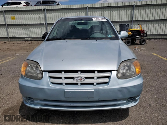 2004 Hyundai Accent GL z VIN KMHCG45C94U574027, wystawiony jako Copart lot #57463905 z przebiegiem 139 595 mil mil oraz Szkoda całkowita • Salvage title. Historia ofert i sprzedaży dostępna na DreamBid. Obrazek 5.