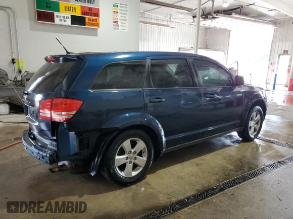 2013 Dodge Journey American Value with VIN 3C4PDCAB4DT581984, listed as a Copart auction lot 59953515 with 166,927 mi miles and Salvage title. Bid and sale history available at DreamBid. Image 3.