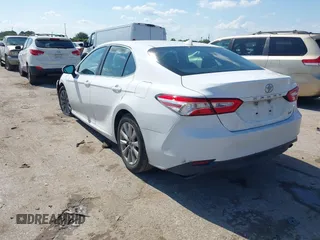 2019 Toyota Camry LE with VIN 4T1B11HK4KU180995, listed as a IAAI auction lot 42088737 with 133,813 mi miles and . Bid and sale history available at DreamBid. Image 3.
