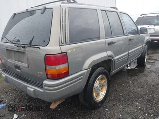 1998 Jeep Grand Cherokee Limited with VIN 1J4GZ78YXWC236969, listed as a IAAI auction lot 41095686 with 182,001 mi miles. Bid and sale history available at carsss.com. Image 4.