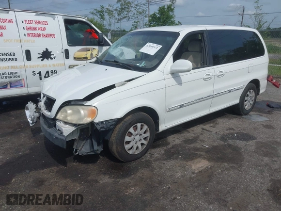 2005 Kia Sedona LX with VIN KNDUP132056702484, listed as a IAAI auction lot 42099572 with 195,528 mi miles and . Bid and sale history available at DreamBid. Image 2.