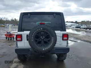 2022 Jeep Wrangler Unlimited Sport S with VIN 1C4HJXDG3NW155467, listed as a IAAI auction lot 41638650 with 22,698 mi miles and . Bid and sale history available at DreamBid. Image 16.