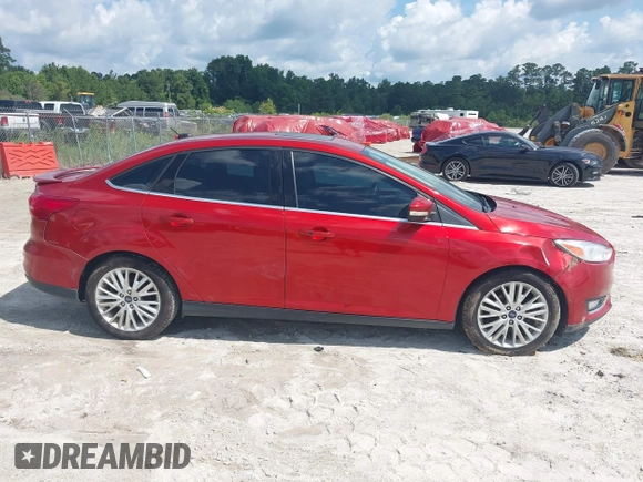 2018 Ford Focus Titanium z VIN 1FADP3J23JL295888, wystawiony jako IAAI lot #42524088 z przebiegiem 108 812 mil mil oraz . Historia ofert i sprzedaży dostępna na DreamBid. Obrazek 13.
