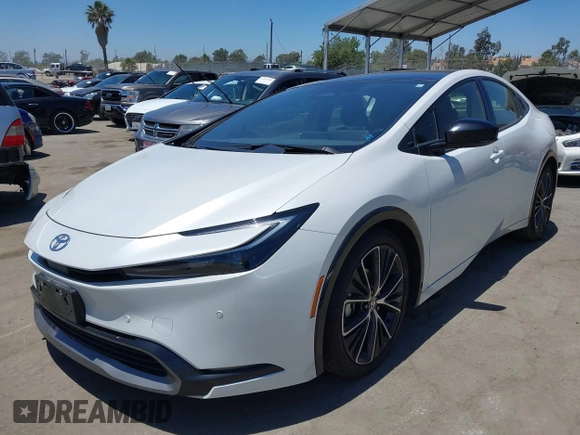 2024 Toyota Prius LE with VIN JTDACAAU2R3020703, listed as a IAAI auction lot 42644240 with 32,715 mi miles and . Bid and sale history available at DreamBid. Image 2.