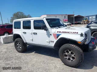 2021 Jeep Wrangler Unlimited Rubicon with VIN 1C4HJXFN9MW519496, listed as a IAAI auction lot 41676845 with 72,767 mi miles. Bid and sale history available at carsss.com. Image 13.