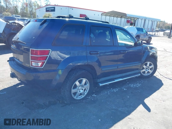 2009 Jeep Grand Cherokee Laredo with VIN 1J8HR48P19C540785, listed as a IAAI auction lot 41729851 with 205,504 mi miles. Bid and sale history available at carsss.com. Image 4.