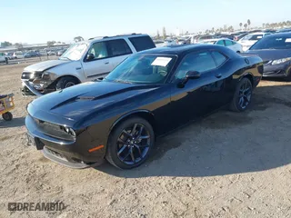2023 Dodge Challenger SXT with VIN 2C3CDZAG0PH597128, listed as a IAAI auction lot 40865123 with 9,362 mi miles. Bid and sale history available at carsss.com. Image 2.