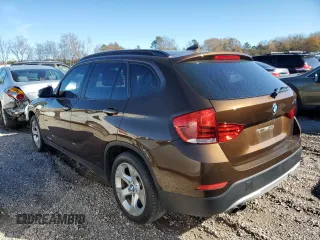 2015 BMW X1 sDrive28i with VIN WBAVM1C54FV316825, listed as a Copart auction lot 83592644 with 76,823 mi miles and Salvage Title. Bid and sale history available at carsss.com. Image 2.