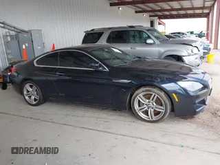2012 BMW 6 Series 650i z VIN WBALX3C51CDV77602, wystawiony jako IAAI lot #41668235 z przebiegiem 103 684 mil mil oraz . Historia ofert i sprzedaży dostępna na DreamBid. Obrazek 13.
