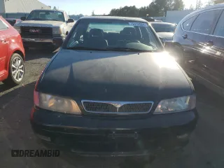 1999 Infiniti G20 z VIN JNKCP11A6XT003028, wystawiony jako Copart lot #72412504 z przebiegiem 157 279 mil mil oraz Szkody całkowita. Historia ofert i sprzedaży dostępna na DreamBid. Obrazek 5.
