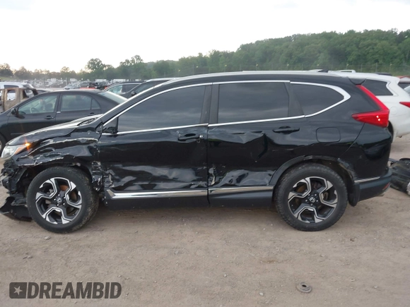 2017 Honda CR-V Touring with VIN 2HKRW2H96HH672017, listed as a IAAI auction lot 42151118 with 144,527 mi miles and . Bid and sale history available at carsss.com. Image 15.