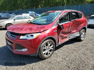 2016 Ford Escape Titanium with VIN 1FMCU9JX0GUC57191, listed as a Copart auction lot 58642535 with 69,653 mi miles and Salvage title. Bid and sale history available at DreamBid. Image 1.