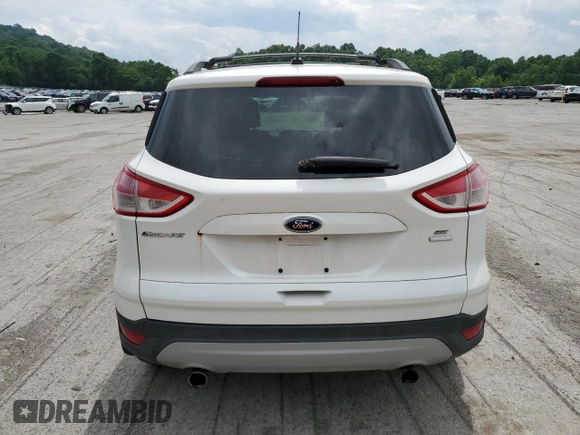 2013 Ford Escape SE with VIN 1FMCU9G9XDUA92061, listed as a Copart auction lot 63074655 with 150,848 mi miles and Salvage title. Bid and sale history available at DreamBid. Image 6.