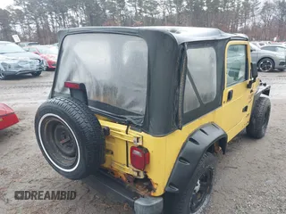 2000 Jeep Wrangler Sport with VIN 1J4FA49S4YP763414, listed as a IAAI auction lot 41478005 with 222,012 mi miles. Bid and sale history available at carsss.com. Image 4.