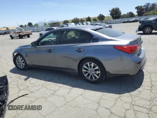 2014 Infiniti Q50 Hybrid Premium with VIN JN1AV7AP5EM690504, listed as a Copart auction lot 55511065 with 79,307 mi miles and Salvage title. Bid and sale history available at DreamBid. Image 2.